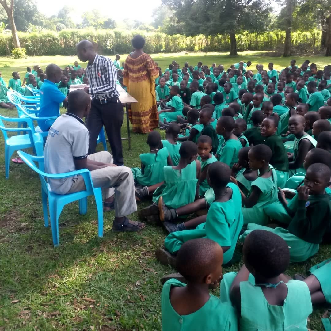 Pupils seated outdoors for a mental health session