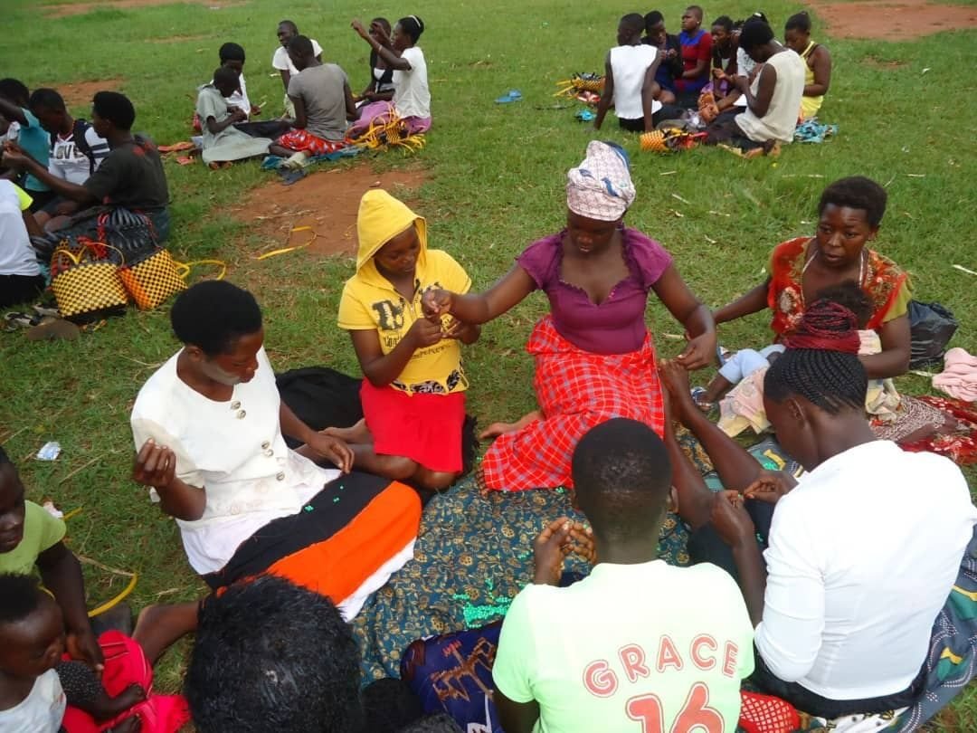 A beadwork group working together outdoors