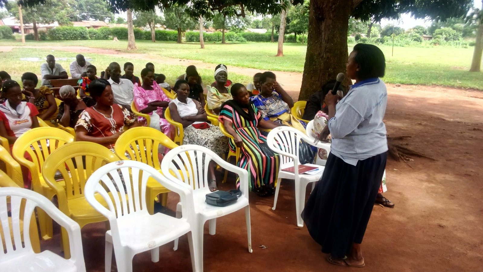 Community members gathered under the trees for a MindWell session